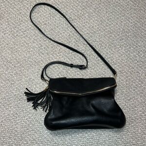 Black leather crossbody purse with tassel zipper